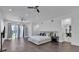 Spacious main bedroom with hardwood floors, recessed lighting, and access to an outdoor patio at 5212 62Nd S Ave, St Petersburg, FL 33715