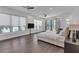 This light-filled bedroom features large windows, wood floors, and two ceiling fans at 5212 62Nd S Ave, St Petersburg, FL 33715