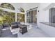 Covered patio with comfortable seating, a fire pit, and outdoor bar at 5212 62Nd S Ave, St Petersburg, FL 33715