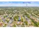 Expansive aerial view of a property with a private pool, surrounded by lush greenery and near downtown Tampa at 603 Royal Crest Drive Dr, Brandon, FL 33511