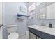 Neat and bright bathroom featuring a large vanity, updated sink and mirror, and a toilet at 603 Royal Crest Dr, Brandon, FL 33511
