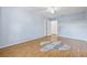 Serene bedroom featuring light blue walls, hardwood floors, and a ceiling fan for optimal comfort at 603 Royal Crest Dr, Brandon, FL 33511