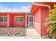 Close-up view of home's entryway, showcasing a cheerful welcome mat, exterior paint, and screened door at 603 Royal Crest Dr, Brandon, FL 33511