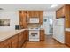 Bright kitchen with wooden cabinets, modern appliances, and tile backsplash at 603 Royal Crest Dr, Brandon, FL 33511