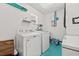 Functional laundry room with a modern washer and dryer, providing convenience and efficiency at 603 Royal Crest Dr, Brandon, FL 33511