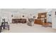 Open-concept living room featuring a brown leather sectional sofa, a plush recliner, and white walls at 603 Royal Crest Drive Dr, Brandon, FL 33511