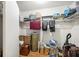 Walk-in closet with metal shelving and storage of boxes and other items at 603 Royal Crest Dr, Brandon, FL 33511