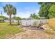 Landscaped yard with garden beds and protective coverings for a great gardening space at 603 Royal Crest Dr, Brandon, FL 33511