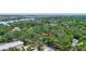 Overhead shot showing the property's wooded surroundings and proximity to a nearby waterway at 706 S 56Th St, Tampa, FL 33619
