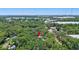 Aerial view of a property nestled amongst the trees in a lush green community at 706 S 56Th St, Tampa, FL 33619