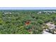 Aerial view of a property nestled amongst the trees in a lush green community at 706 S 56Th St, Tampa, FL 33619