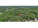 Aerial view of a property nestled amongst the trees in a lush green community at 706 S 56Th St, Tampa, FL 33619