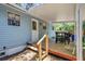 Cozy covered back deck with outdoor dining set, perfect for relaxing and entertaining at 706 S 56Th St, Tampa, FL 33619
