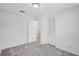 Bedroom with neutral walls, plush carpeting, and ample closet space at 706 S 56Th St, Tampa, FL 33619