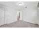 Bright bedroom features neutral walls, plush carpeting, and closet for ample storage at 706 S 56Th St, Tampa, FL 33619