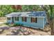 Charming single-story home featuring light blue siding, mature landscaping, and inviting front entrance at 706 S 56Th St, Tampa, FL 33619