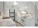 Bright kitchen featuring white cabinets, marble countertops and stainless steel appliances at 706 S 56Th St, Tampa, FL 33619