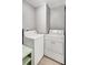 Laundry area with white washer and dryer units with ample space at 706 S 56Th St, Tampa, FL 33619