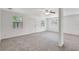 Spacious living room with neutral carpeting, ceiling fan, and nice natural light at 706 S 56Th St, Tampa, FL 33619