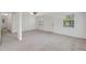 Open living room featuring neutral color palette, ceiling fan, and entry door at 706 S 56Th St, Tampa, FL 33619