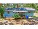 Back of house featuring a covered porch, perfect for outdoor dining and relaxation at 706 S 56Th St, Tampa, FL 33619