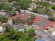 Aerial view of community courts, featuring tennis, basketball, and pickleball courts at 7535 Greystone Dr, Hudson, FL 34667