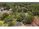 Scenic overhead view of the community featuring mature trees, residential streets, and well-maintained lawns at 7535 Greystone Dr, Hudson, FL 34667