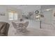 Bright and airy, living room with dining area combo, featuring neutral colored carpet at 7535 Greystone Dr, Hudson, FL 34667