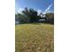 A view of a large grassy backyard at 7620 32Nd S Ave, Tampa, FL 33619