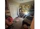 Small bedroom view with a bed, piano, toys, and accessories at 7620 32Nd S Ave, Tampa, FL 33619