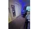 Another angle of personalized bedroom with dark carpet and décor, offering relaxation and rest at 7620 32Nd S Ave, Tampa, FL 33619