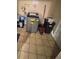 A small laundry area with a washing machine, cleaning supplies, and cleaning utensils at 7620 32Nd S Ave, Tampa, FL 33619