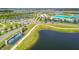 Aerial view of Epperson community featuring an intersection, fountain and a recreational body of water at 8421 Ivy Stark Blvd, Wesley Chapel, FL 33545