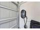 Interior shot of the garage with an electric car charging station at 8421 Ivy Stark Blvd, Wesley Chapel, FL 33545
