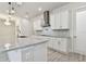 A gourmet kitchen with modern appliances, granite countertops, and stylish pendant lighting at 8421 Ivy Stark Blvd, Wesley Chapel, FL 33545