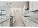 Well-equipped kitchen featuring stainless appliances, granite countertops, and center island at 8421 Ivy Stark Blvd, Wesley Chapel, FL 33545