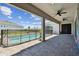 View from the covered patio of the fenced in pool and backyard at 8421 Ivy Stark Blvd, Wesley Chapel, FL 33545