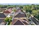 An elevated aerial view showing the roofs of homes, foliage, and street view of the neighborhood at 8820 Cypress Hammock Dr, Tampa, FL 33614