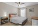 Comfortable bedroom with a large bed, carpet flooring, ceiling fan and window at 8820 Cypress Hammock Dr, Tampa, FL 33614