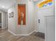 Bright foyer with wood-look flooring and niche for displaying decor, bathed in natural light at 8820 Cypress Hammock Dr, Tampa, FL 33614