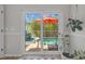 Sliding glass doors lead to a screened lanai with a pool and comfortable outdoor seating at 8820 Cypress Hammock Dr, Tampa, FL 33614