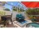 A stylish backyard pool with a grill and cozy seating area perfect for relaxing at 8820 Cypress Hammock Dr, Tampa, FL 33614