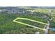 Aerial view showing approximate outline of the lot within a wooded area, offering privacy and seclusion at 8828 Jasmine Blvd, Port Richey, FL 34668