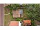 Overhead view of house with small back yard and trees, in need of repair at 910 W Virginia Ave, Tampa, FL 33603