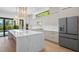 Modern kitchen features quartz countertops, stainless steel appliances, and a large island for seating at 910 W Virginia Ave, Tampa, FL 33603