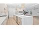 Modern kitchen features light wood cabinetry, stone countertops and backsplash, and stainless steel appliances at 910 W Virginia Ave, Tampa, FL 33603