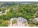 An aerial image highlighting homes with driveway parking and mature trees providing shade at 9473 N Forest Hills Pl, Tampa, FL 33612