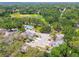 Overhead shot of homes with driveway parking near a grassy field and treed area at 9473 N Forest Hills Pl, Tampa, FL 33612