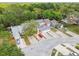 Three houses with mature tree landscaping, double garages, and parking at 9473 N Forest Hills Pl, Tampa, FL 33612
