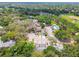 Residential community with pool and green space surrounded by mature trees at 9473 N Forest Hills Pl, Tampa, FL 33612